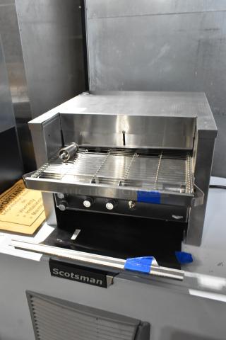 Brand new Vollrath JT2000 stainless steel commercial conveyor toaster with 1 1/2" opening; minor scratches, 240V, 1 phase.