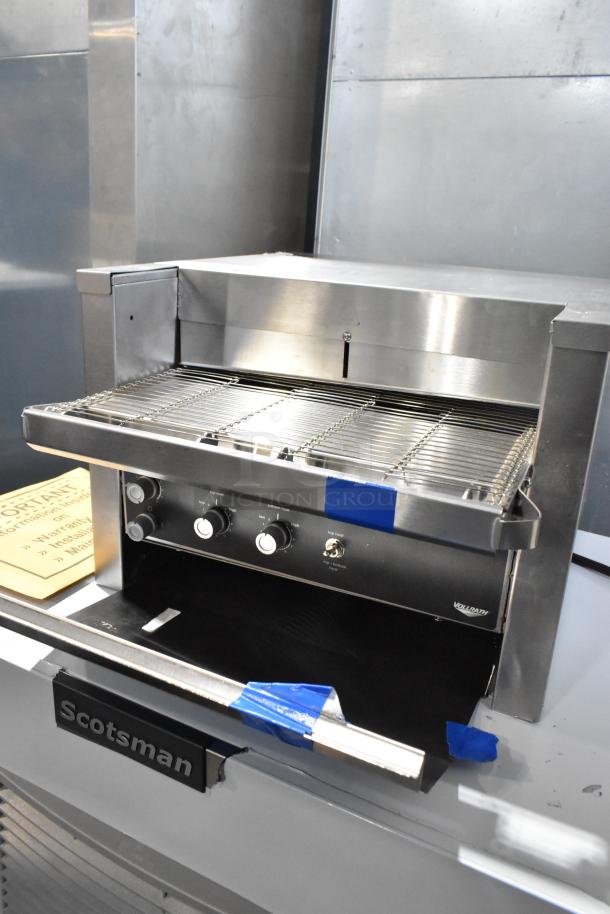 Vollrath JT2000 stainless steel conveyor toaster, 1 1/2" opening, new with scratches. 240V, 1 phase, model label visible.