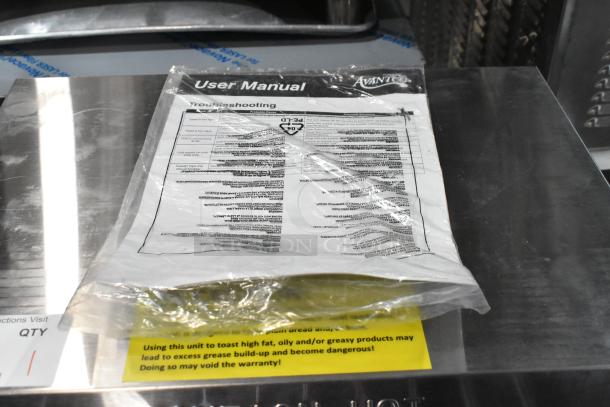 Brand new Avantco 184T3600D stainless steel conveyor toaster, 14 1/2" wide, 3" opening, user manual on top, 1200 slices/hr, 240V.