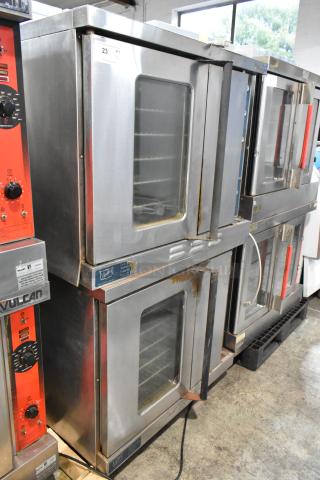 2 Duke 613-G2V stainless steel convection ovens with view-through and solid doors, metal racks, and thermostatic controls.