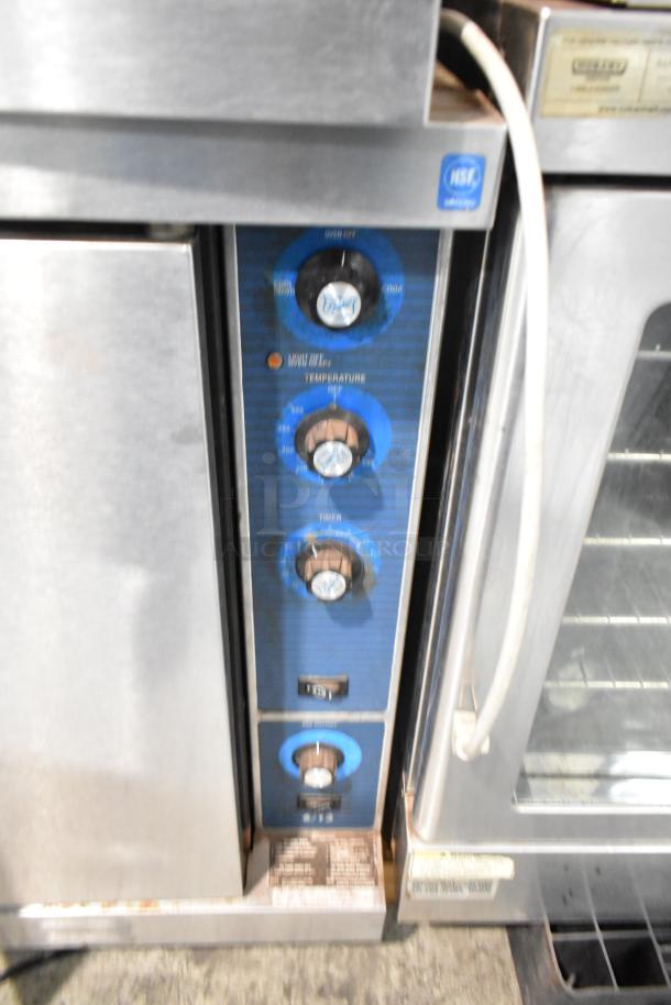 Duke 613-G2V stainless steel convection oven with view-through door, solid door, metal racks, and thermostatic controls.