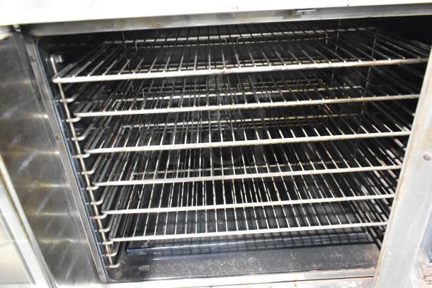 Duke 613-G2V stainless steel convection oven with view-through and solid doors, metal racks, and thermostatic controls.