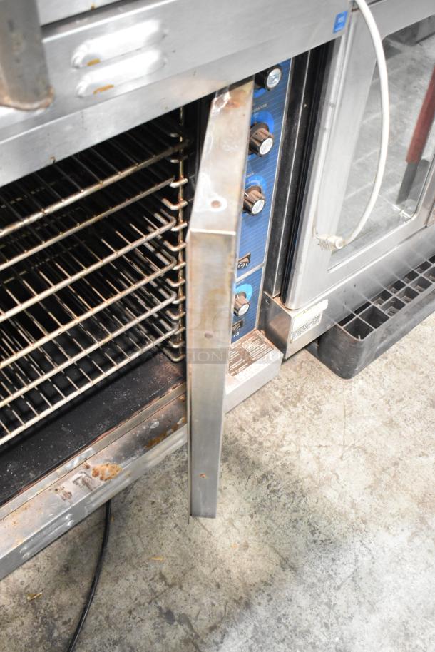 Duke 613-G2V stainless steel commercial convection oven, view-through door, metal racks, thermostatic controls, fair condition, visible rust.