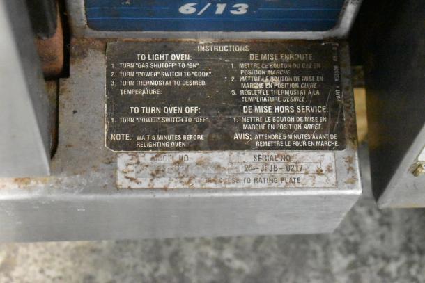 Duke 613-G2V convection oven control panel with operating instructions and serial number tag visible.