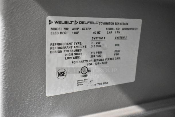 2022 Delfield 406P-STAR2 stainless steel single door undercounter cooler on commercial casters, 115V, 1 phase. Label shows model and specs.
