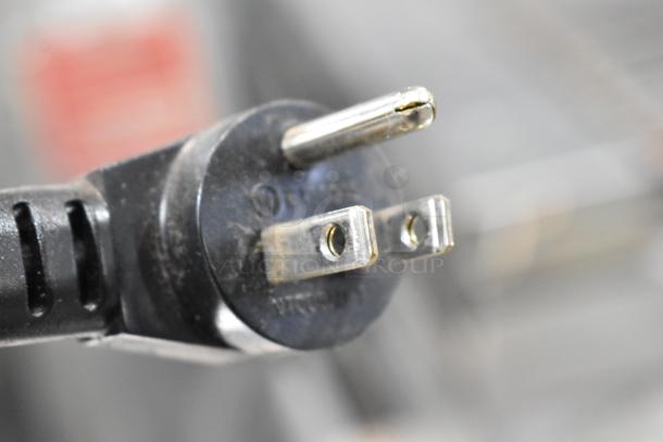Close-up of the power plug for a 2019 Delfield 406P-STAR2 stainless steel undercounter cooler. 115 volts.