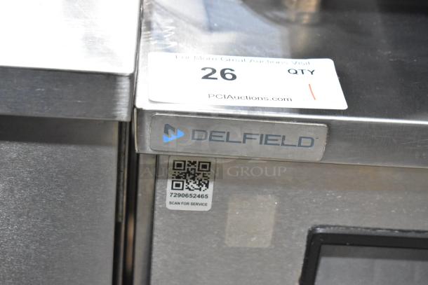 2019 Delfield 406P-STAR2 stainless steel undercounter cooler with casters. Features Delfield logo and service QR code.