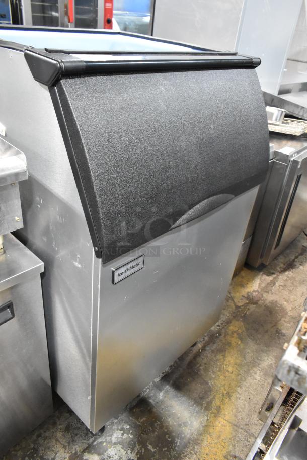 Brand new 2025 Ice-O-Matic B55PSC stainless steel commercial ice bin, scratch and dent condition, logo visible.
