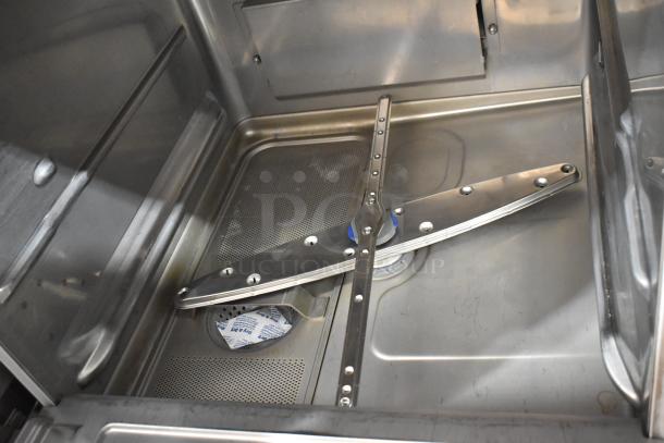2023 Hobart LXER stainless steel undercounter dishwasher, interior view. Features robust spray arms and durable construction.