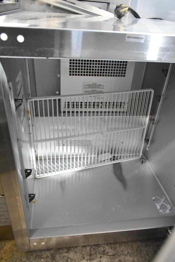 2023 Traulsen UHT27R0-0300 commercial undercounter cooler, stainless steel, single door, 115V, interior view, shelving.