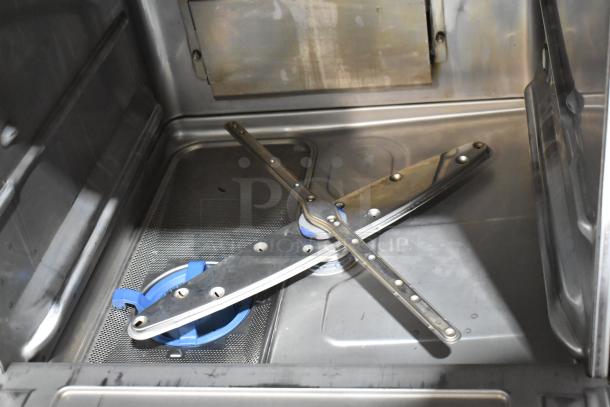 Hobart LXNR stainless steel undercounter dishwasher interior, showcasing wash arms. Model in good condition for commercial use.