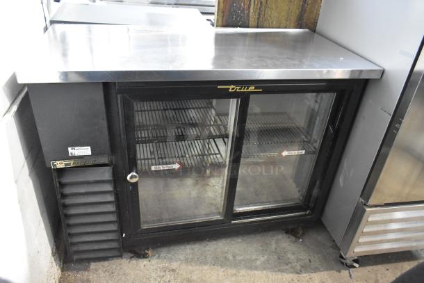 True TBB-24-48G-SD metal 2 door undercounter bar cooler on casters. Features glass doors, branded, 115V, 1 phase.