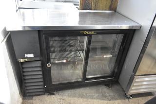 True TBB-24-48G-SD metal 2 door undercounter bar cooler on casters. Features glass doors, branded, 115V, 1 phase.