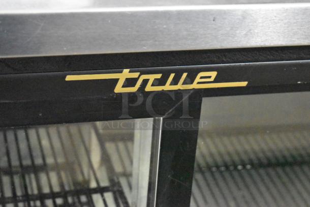 True TBB-24-48G-SD cooler, undercounter 2-door model, commercial-grade, metal finish, branded logo visible, on casters.