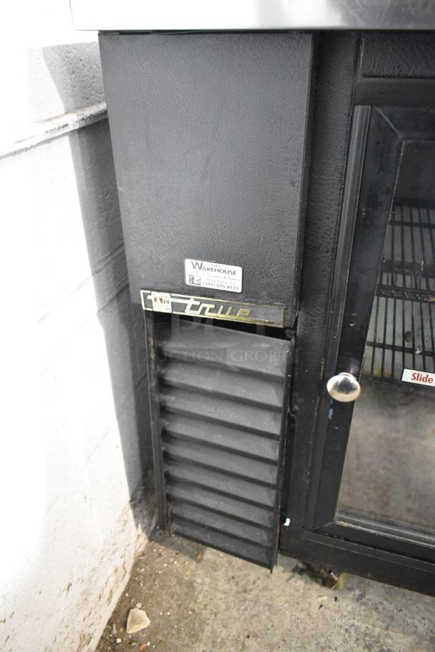 True TBB-24-48G-SD 2-door undercounter back bar cooler, metal, on commercial casters. 115 volts, 1 phase, intact label.