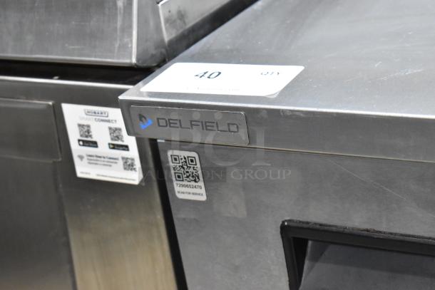 2019 Delfield 406P-STAR2 stainless steel undercounter cooler, single door, commercial casters, 115V, 1 phase, QR code visible.