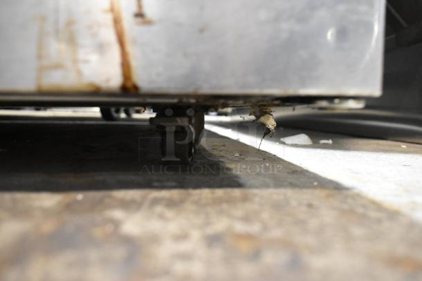 2019 Delfield 406P-STAR2 undercounter cooler, stainless steel, on commercial casters, 115V, 1 phase, showing bottom edge.