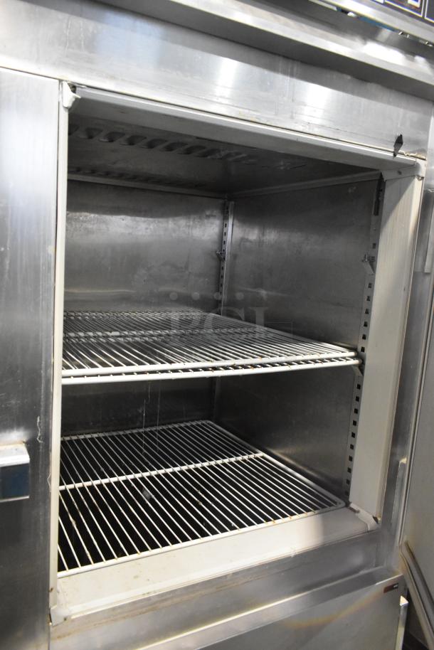 Victory FS-2D-S7-EW-HD stainless steel commercial cooler, four half-size doors, shelves, commercial casters, good condition.