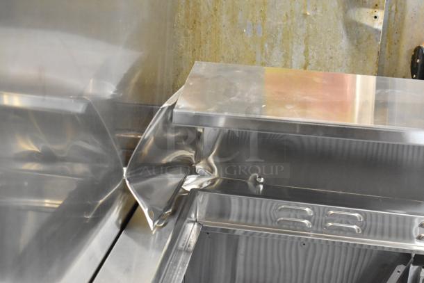 Atosa MSF8302GR stainless steel prep table, missing lid and door, visible damage, on commercial casters. 115 Volts, 1 Phase.