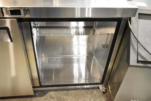 Atosa MSF8302GR stainless steel prep table, missing lid and door, on commercial casters. Interior view shown. 115V, 1 phase.