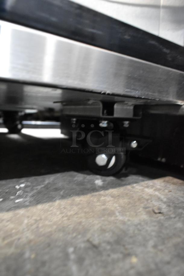 Atosa MSF8302GR stainless steel prep table on commercial casters, missing lid and door, 115V, 1 phase.