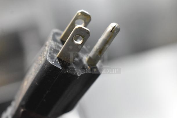 Close-up of a power plug for a Manitowoc ice machine, model UY0140A-161B, 115 volts, 1 phase.