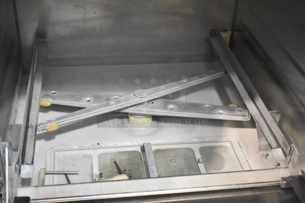 Hobart LX30H stainless steel commercial dishwasher interior, showing spray arm and filters. Used condition. 120/208 volts, 1 phase.