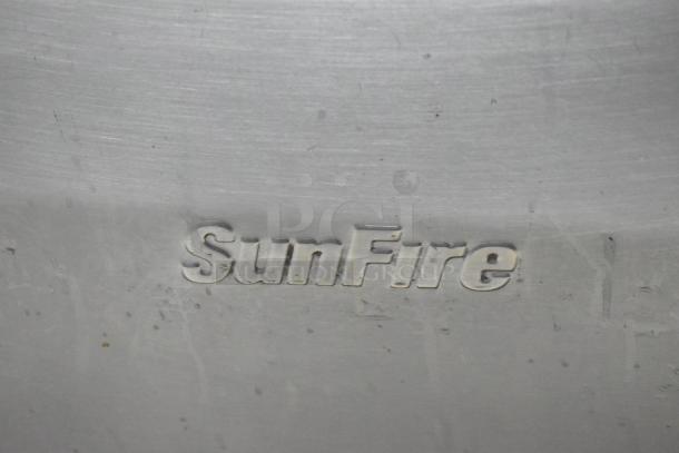 Garland SunFire stainless steel commercial gas range with 10 burners, 2 ovens, overshelf, and casters. SunFire logo visible.