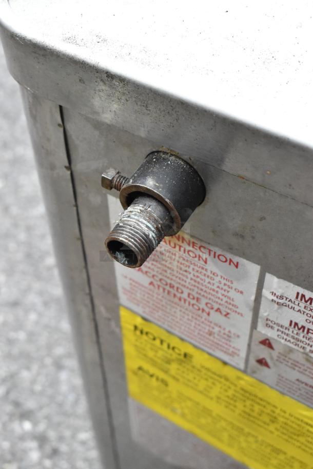 Blodgett 1060B stainless steel pizza oven connector detail, showing threading and caution labels.