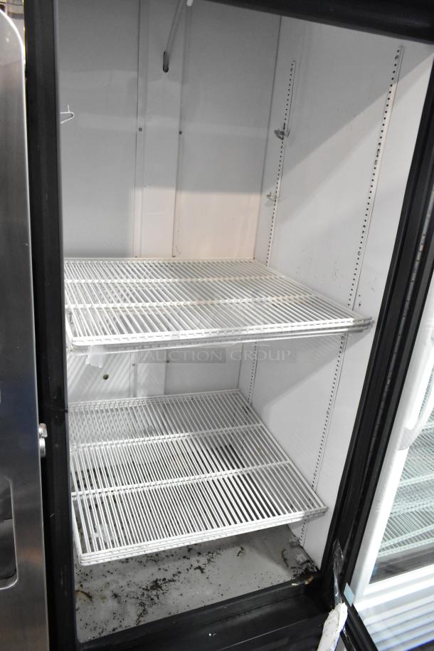 2019 True GDM-26-HC metal single door cooler with poly coated racks, 115 volts, 1 phase. Interior shows wear.