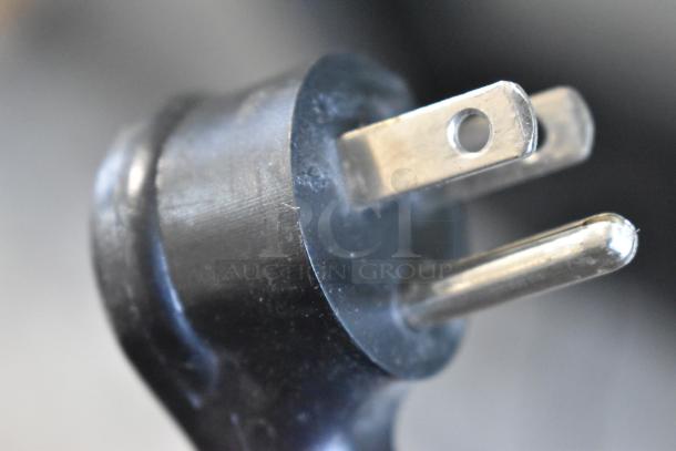 Close-up image of a power plug, part of the 2019 True GDM-26-HC commercial cooler, 115 volts, single phase.
