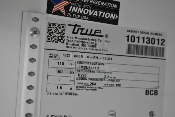 Label on 2021 True TSCI-600R-G-PH cooler showing model, serial number, and technical specs like voltage and refrigerant type.