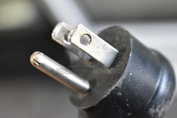 Close-up of the plug for the 2021 True TSCI-600R-G-PH Single Door Reach In Cooler, showing a 115V plug.