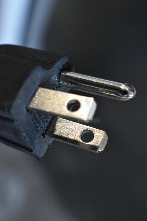 Close-up image of a power plug for the Frigidaire Gallery FGFRF699 stainless steel single door freezer.