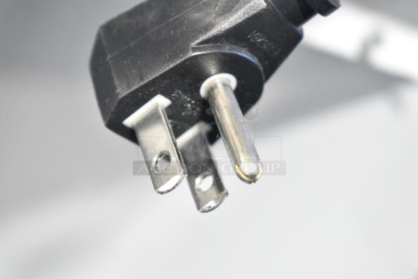Close-up of a three-prong plug for a True GDM-12-LD commercial cooler, suitable for 115 volts, 1 phase.