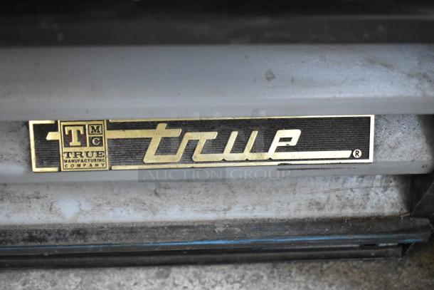 2016 True GDM-12-LD single door commercial cooler, metal frame, poly-coated racks, 115V. Features True logo label.