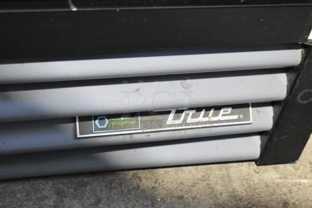 2021 True GDM-12-HC single-door cooler; metal frame, poly racks; 115V, 1-phase. Label shows "True" and "natural refrigerant."