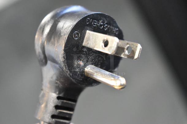 Close-up of a three-prong power plug for the 2021 True GDM-12-HC commercial cooler, 115 volts, 1 phase.