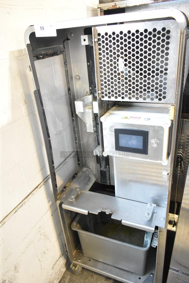 JBT 2ND-GEN-MFJ-HE stainless steel commercial citrus juicer, 120V, 1 phase, on casters, showing internal components.