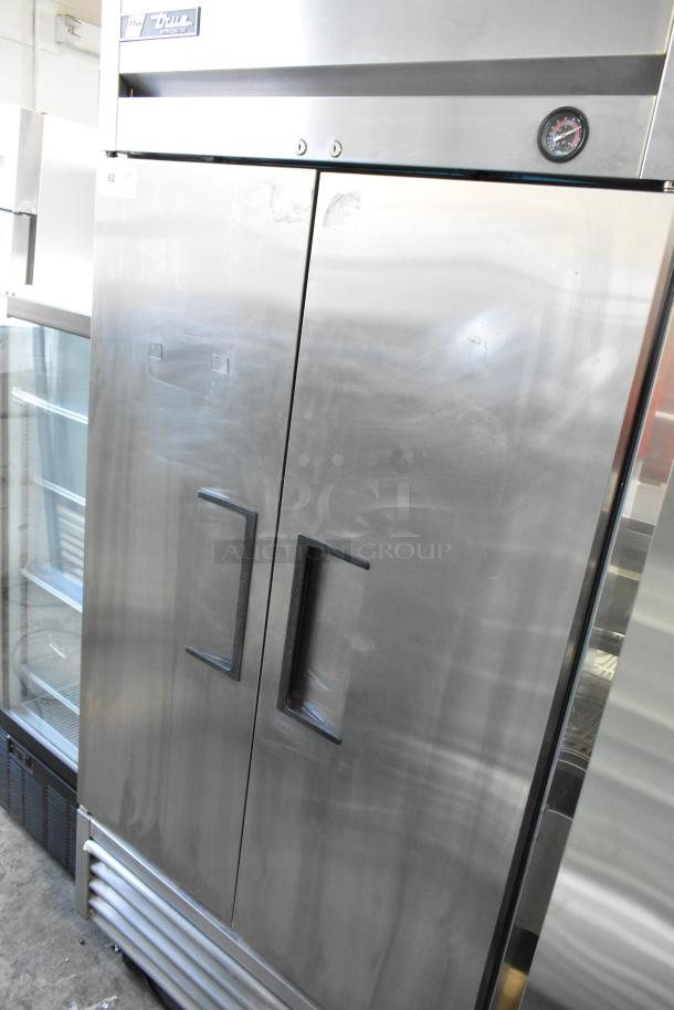 2017 True T-35 stainless steel commercial 2-door reach-in cooler with poly-coated racks, on commercial casters, 115V, 1 phase.