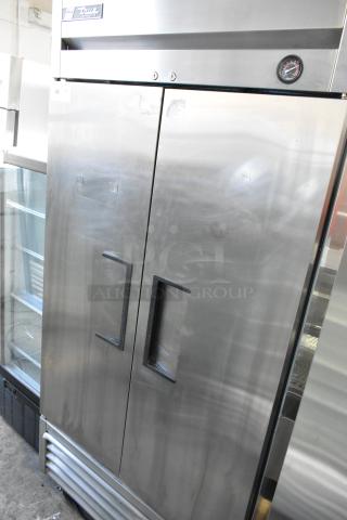 2017 True T-35 stainless steel commercial 2-door reach-in cooler with poly-coated racks, on commercial casters, 115V, 1 phase.