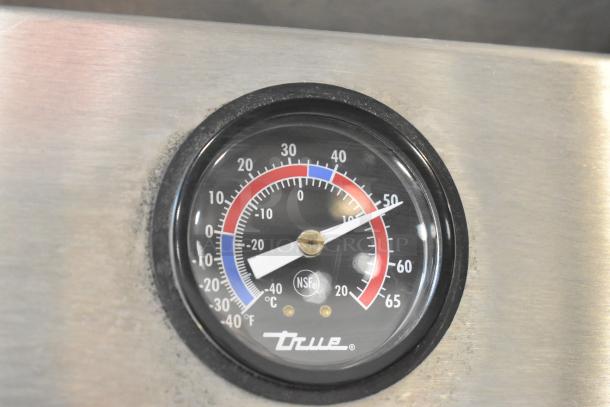 True T-35 cooler thermometer detail, displaying temperature in degrees. Stainless steel finish with NSF certification label.
