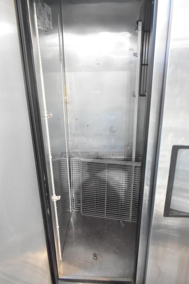 2017 True T-35 stainless steel 2-door reach-in cooler with poly coated racks on casters, 115V, 1 phase. Interior view.