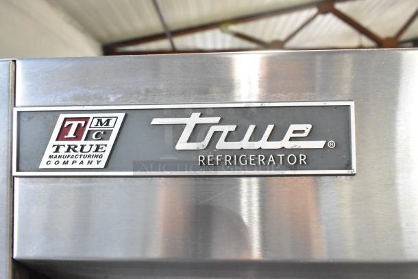 2017 True T-35 stainless steel commercial cooler, label shows True logo and model. Features 2 doors, poly racks, casters.