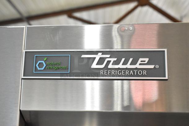 True T-35-HC stainless steel commercial cooler, featuring "natural refrigerant" label. New condition, scratch and dent.