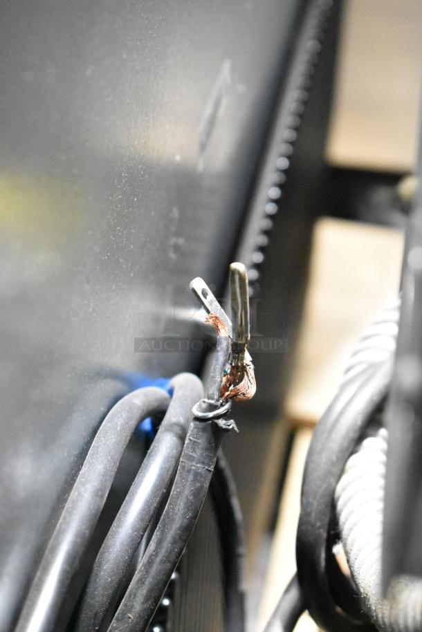 Damaged wiring on a True T-35-HC stainless steel commercial cooler. Brand new but with visible scratch and dent damage.