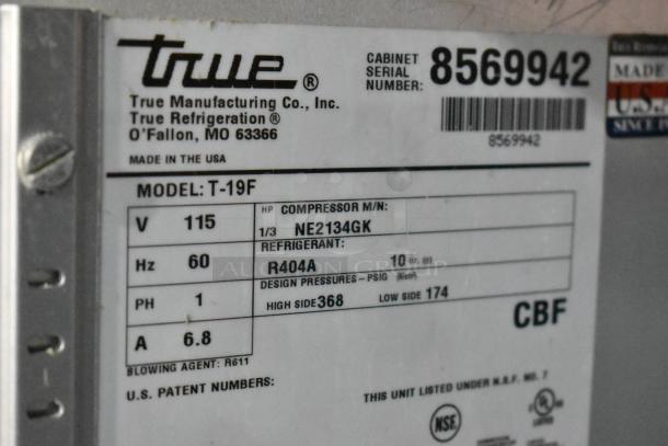 True T-19F stainless steel commercial freezer, label showing model, 115 volts, 1 phase, serial number 8569942.