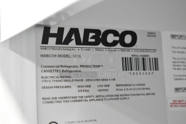 Label indicating Habco SE18 model, commercial refrigerator, 115V, single phase. Features refrigerant details and safety instructions.