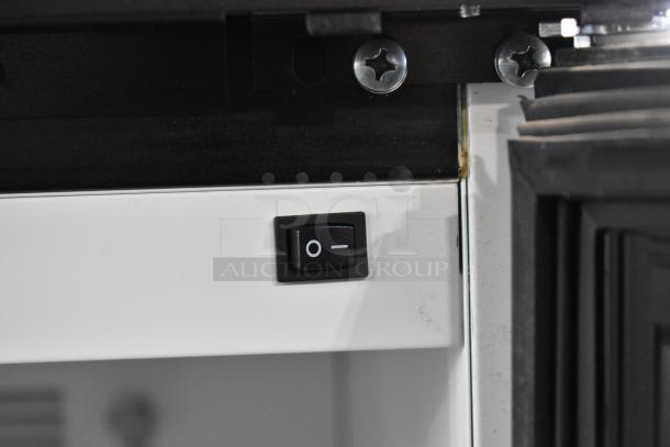 Power switch of a 2019 Habco SE18 commercial cooler. Visible screws and door seal in detail.