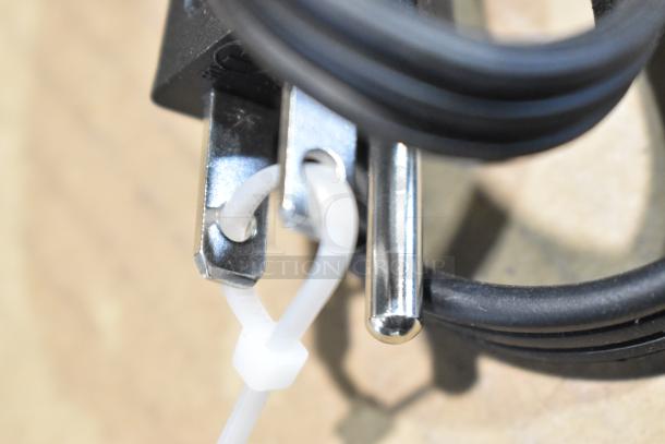 Close-up of the plug from the MS9402482514-01 metal countertop electric 2-burner hot plate range, 120 volts, 1 phase.